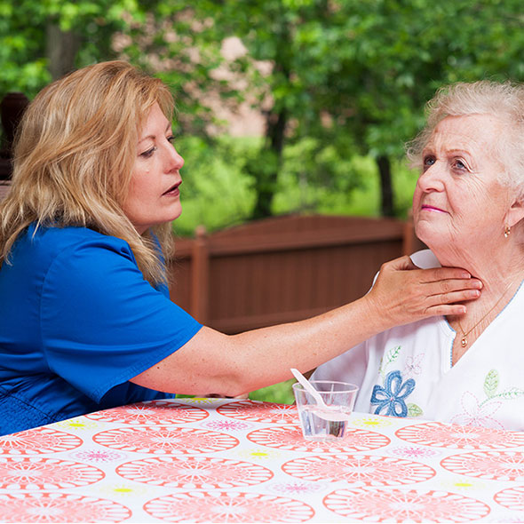 photo of speech therapist working with patient